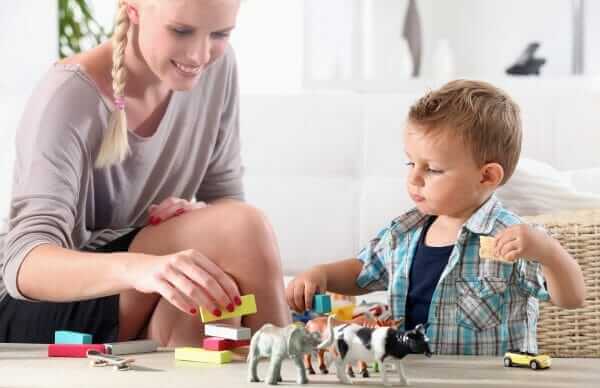 mom and floor playing blocks