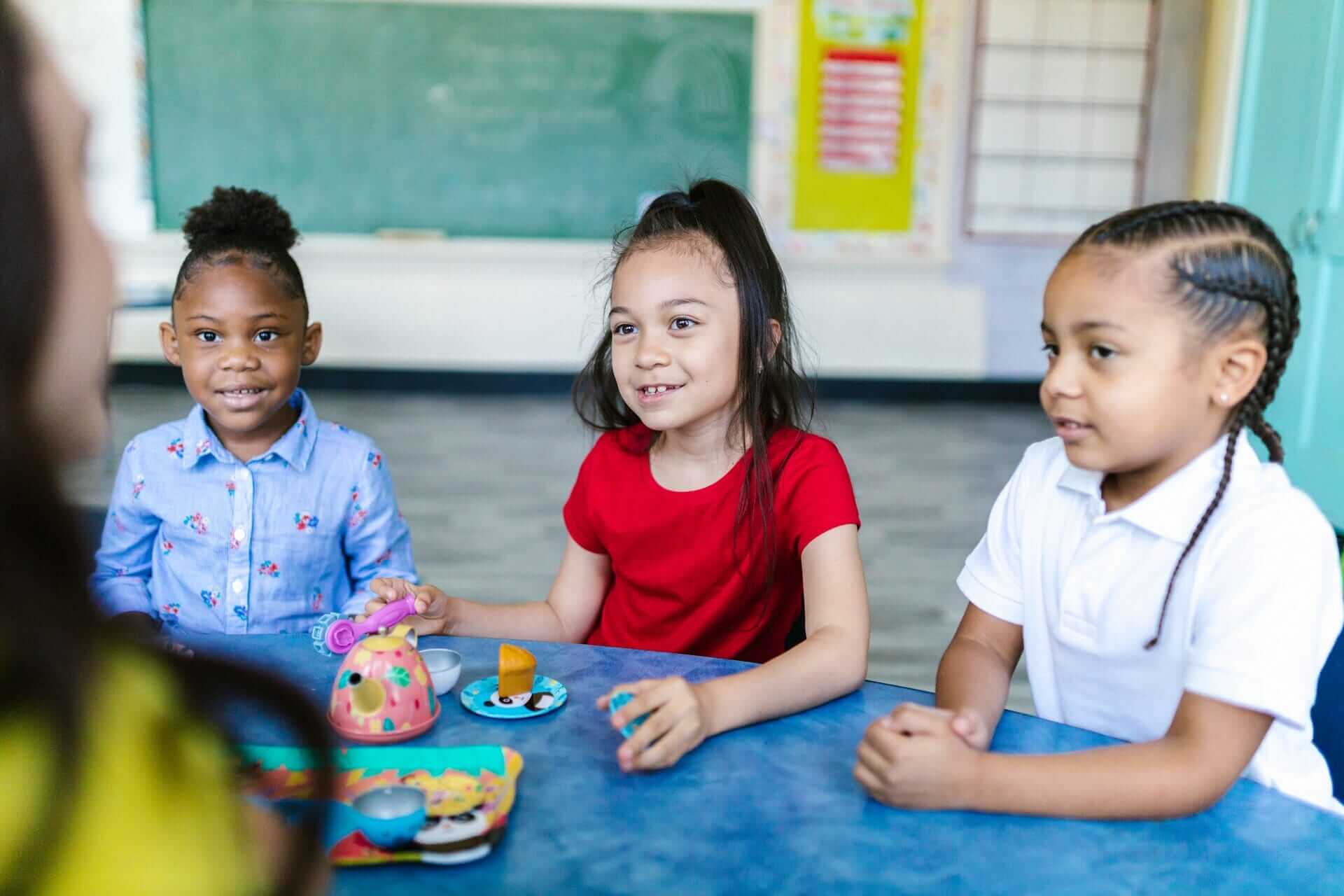 Young students looking at teacher